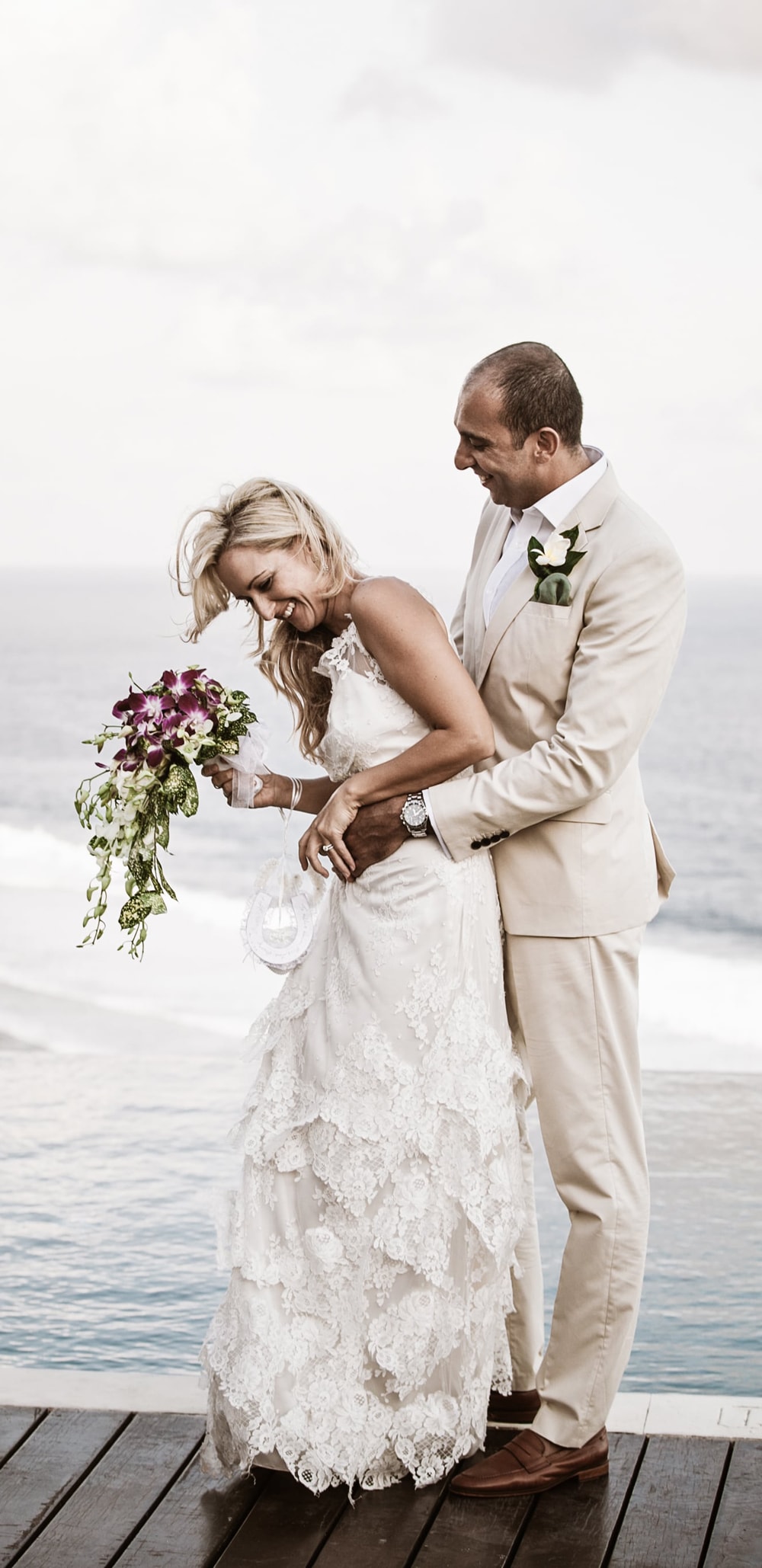 Bali Clifftop Wedding - bride and groom at the infinity pool with ocean view background